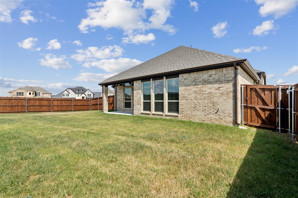 2540 Baypoint Drive Grand Prairie, TX 75054 - Photo 34 of 34 a view of a house with a garden