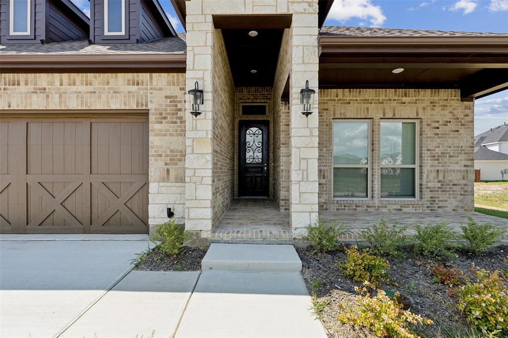 2540 Baypoint Drive Grand Prairie, TX 75054 - Photo 6 of 34 a front view of a house with entryway
