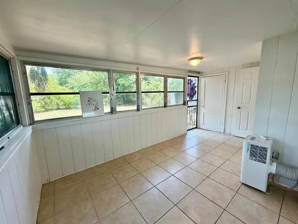 a view of an empty room with a window