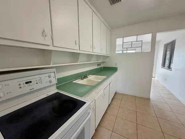 a kitchen with a cabinets and washing machine