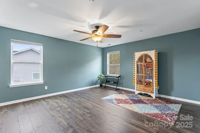 a view of a livingroom with furniture and a workspace