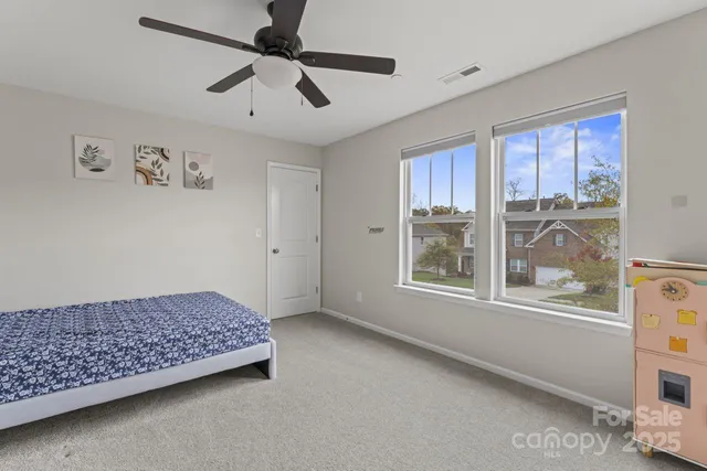 a bedroom with furniture and window