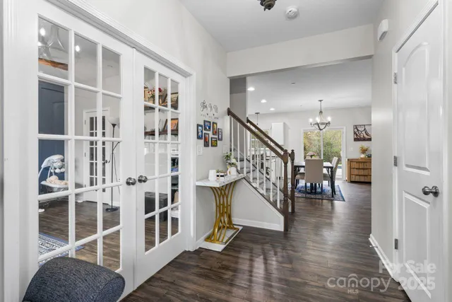 a view of staircase with white walls and windows