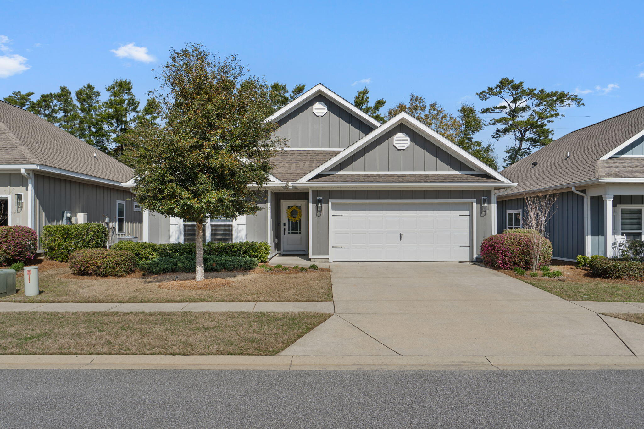 371 Lightning Bug Lane Freeport, FL 32439 - Photo 1 of 56 a front view of a house with a yard and garage