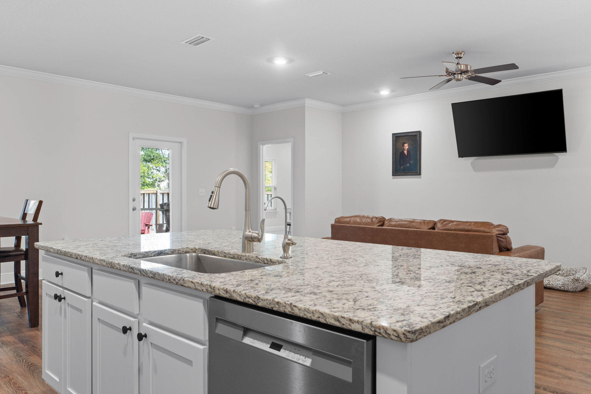 371 Lightning Bug Lane Freeport, FL 32439 - Photo 12 of 56 a kitchen with granite countertop stainless steel appliances sink and microwave