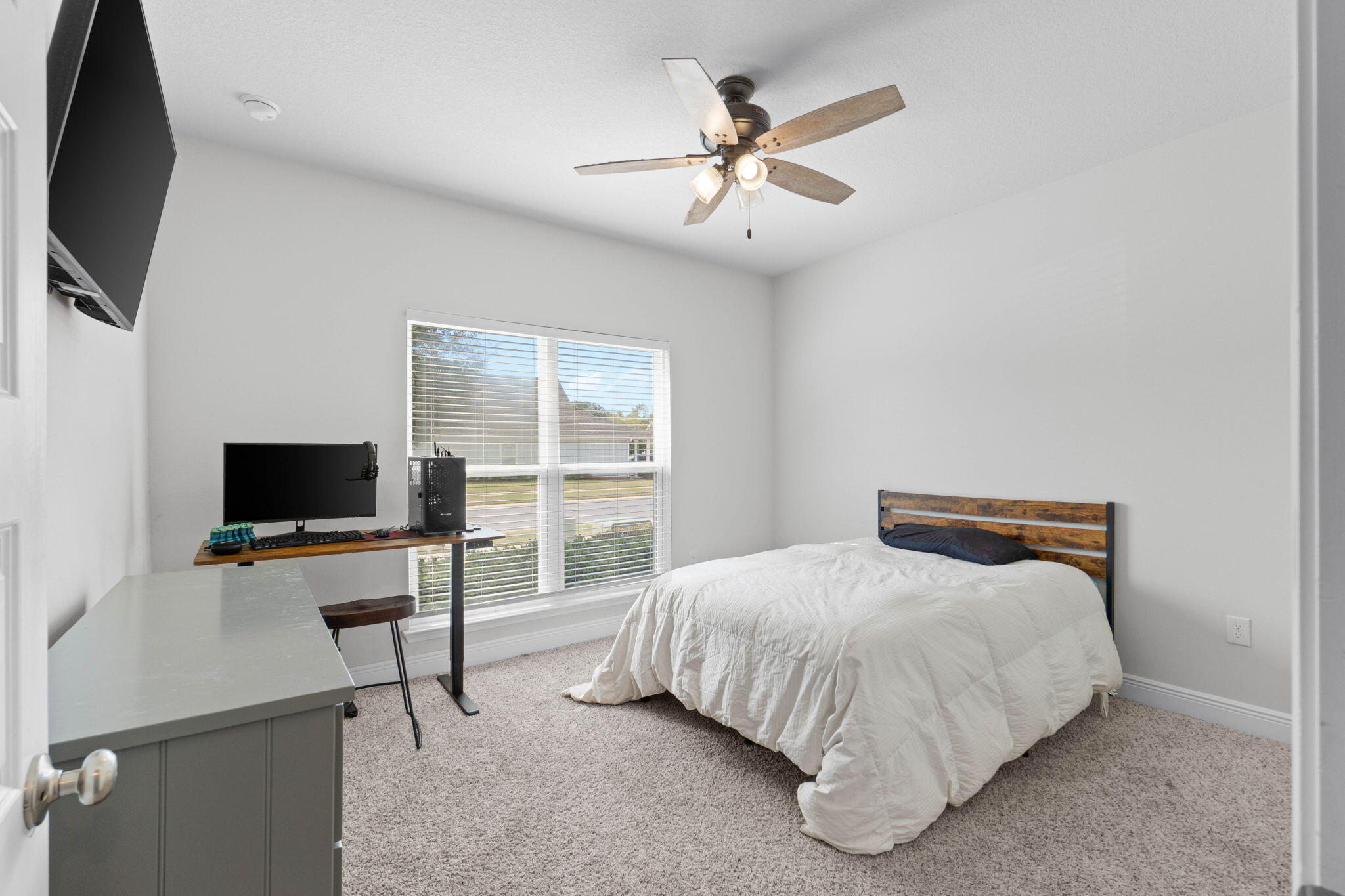 371 Lightning Bug Lane Freeport, FL 32439 - Photo 13 of 56 a bedroom with a bed and a flat screen tv
