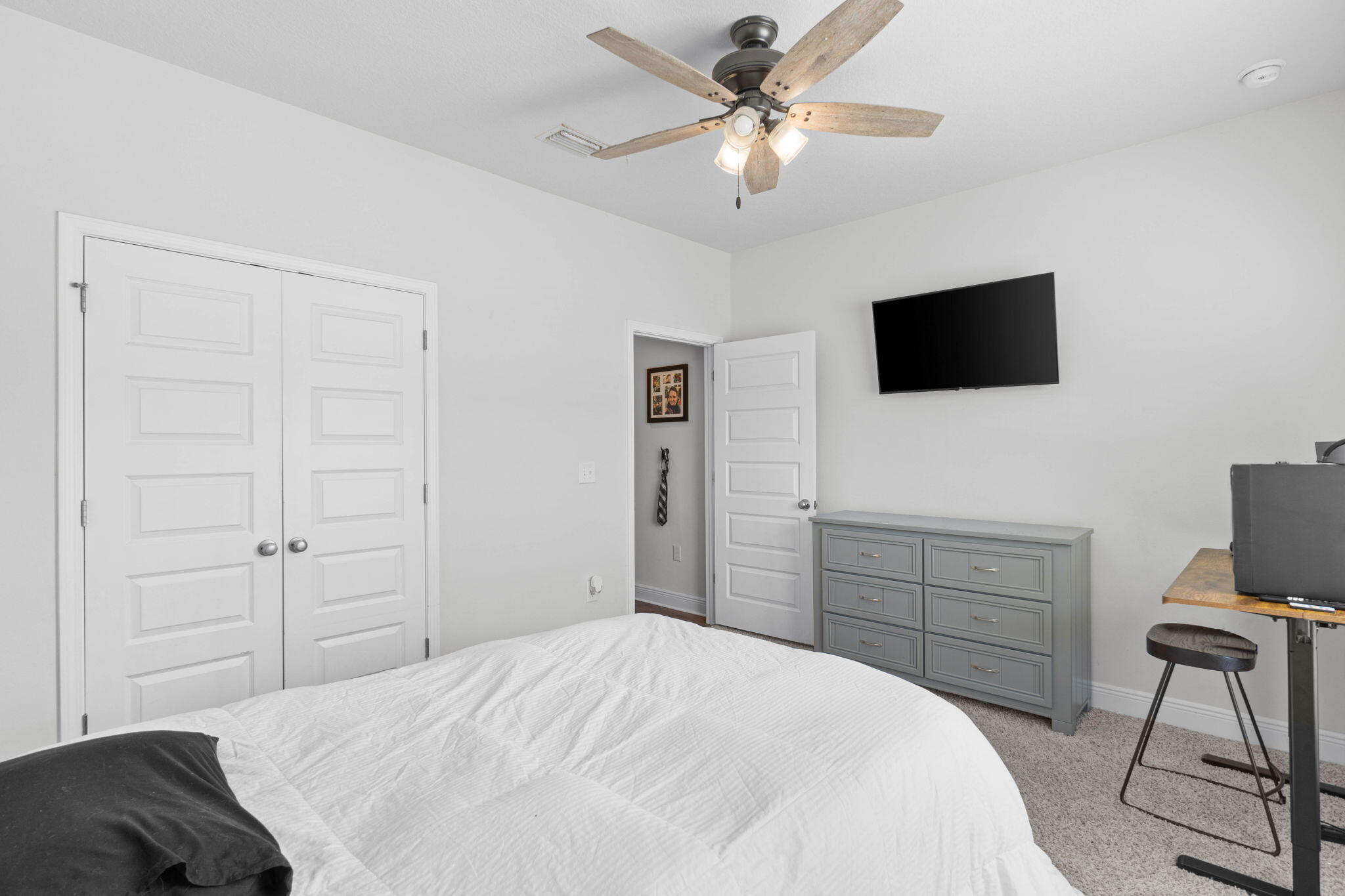 371 Lightning Bug Lane Freeport, FL 32439 - Photo 14 of 56 a bedroom with a bed and a flat screen tv