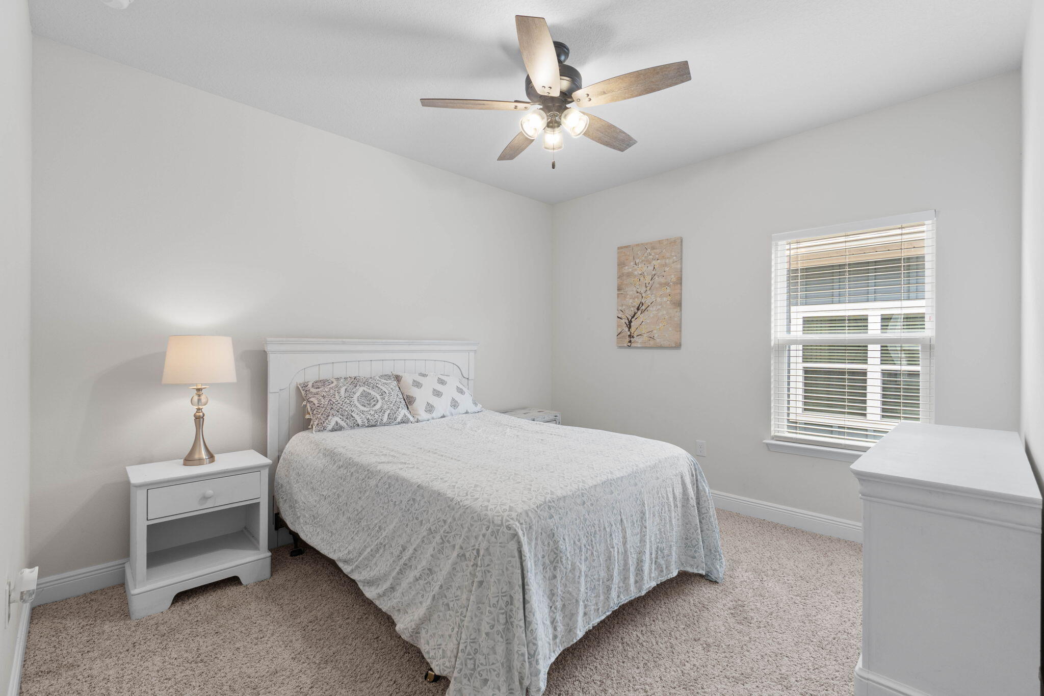 371 Lightning Bug Lane Freeport, FL 32439 - Photo 22 of 53 a bedroom with a bed chandelier and a window