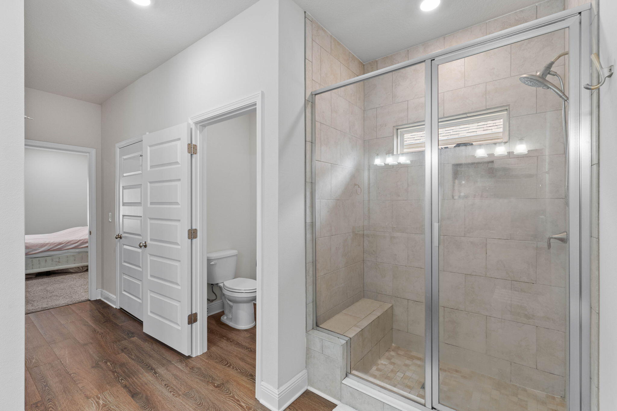 371 Lightning Bug Lane Freeport, FL 32439 - Photo 24 of 56 a bathroom that has a glass shower door