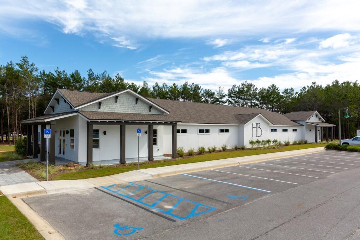 371 Lightning Bug Lane Freeport, FL 32439 - Photo 38 of 56 a view of a house with a big yard and large trees