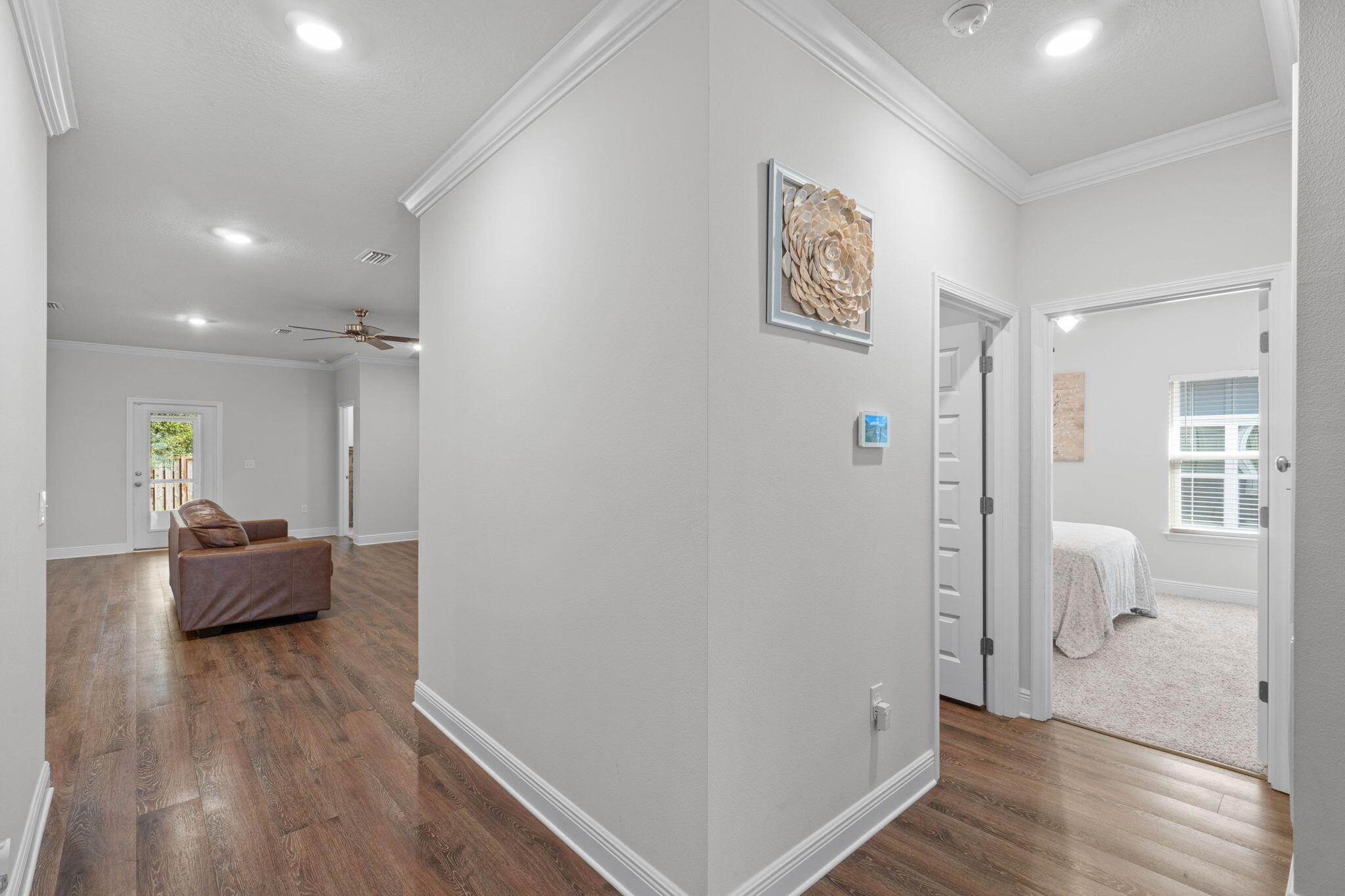 371 Lightning Bug Lane Freeport, FL 32439 - Photo 5 of 56 a view of a hallway with wooden floor and furniture