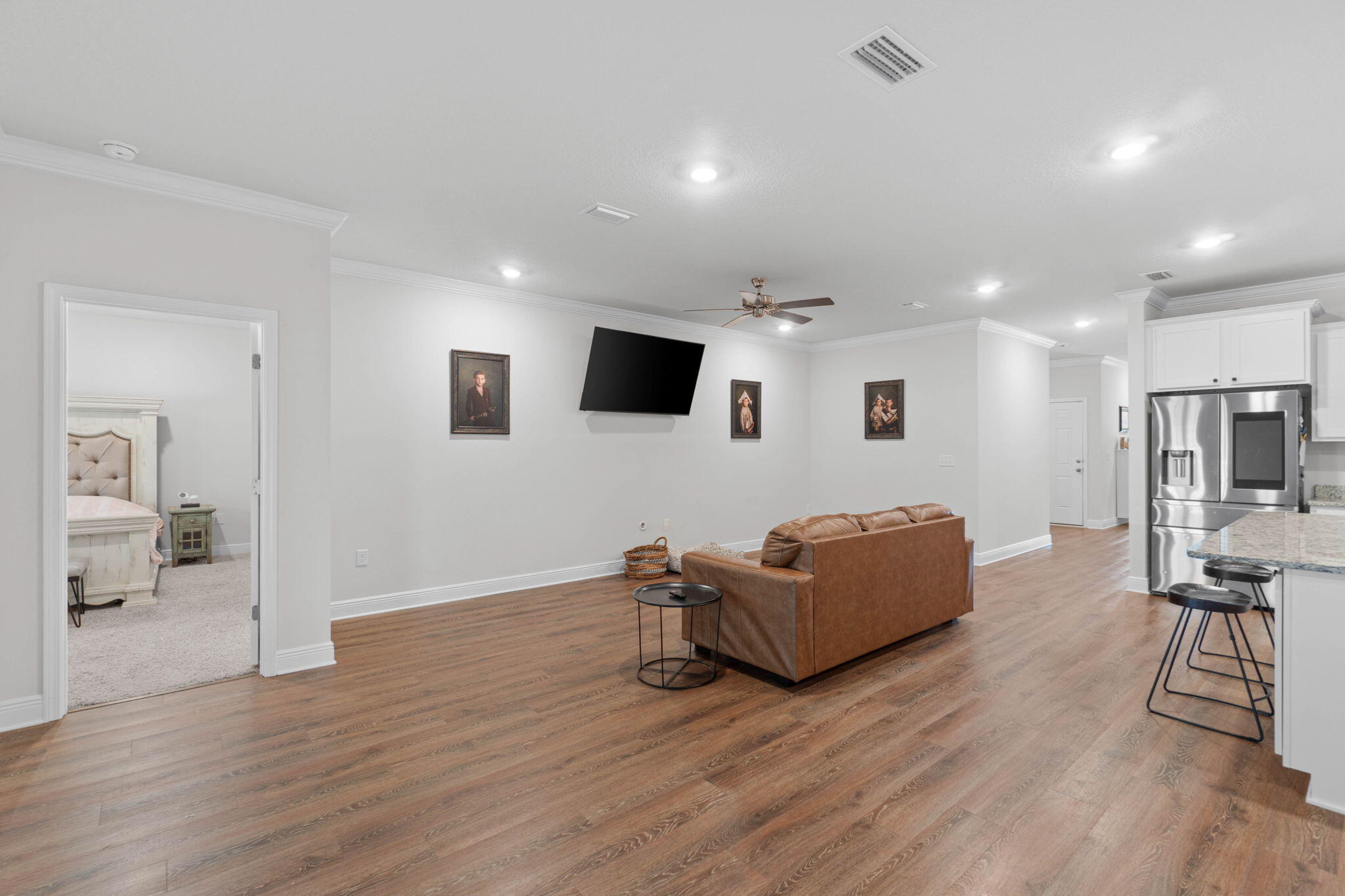 371 Lightning Bug Lane Freeport, FL 32439 - Photo 7 of 56 a living room with furniture and a flat screen tv