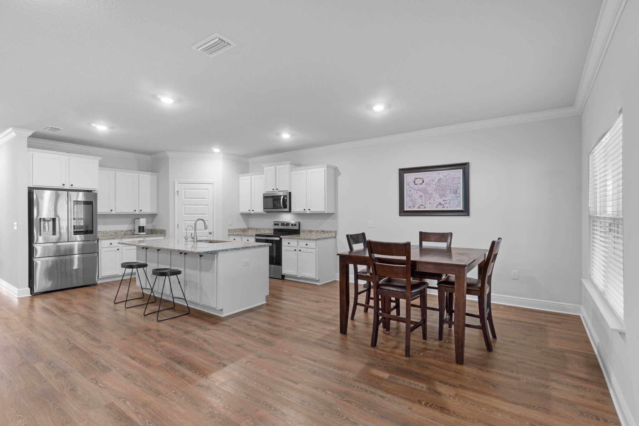 371 Lightning Bug Lane Freeport, FL 32439 - Photo 8 of 56 a view of a dining room with furniture and wooden floor