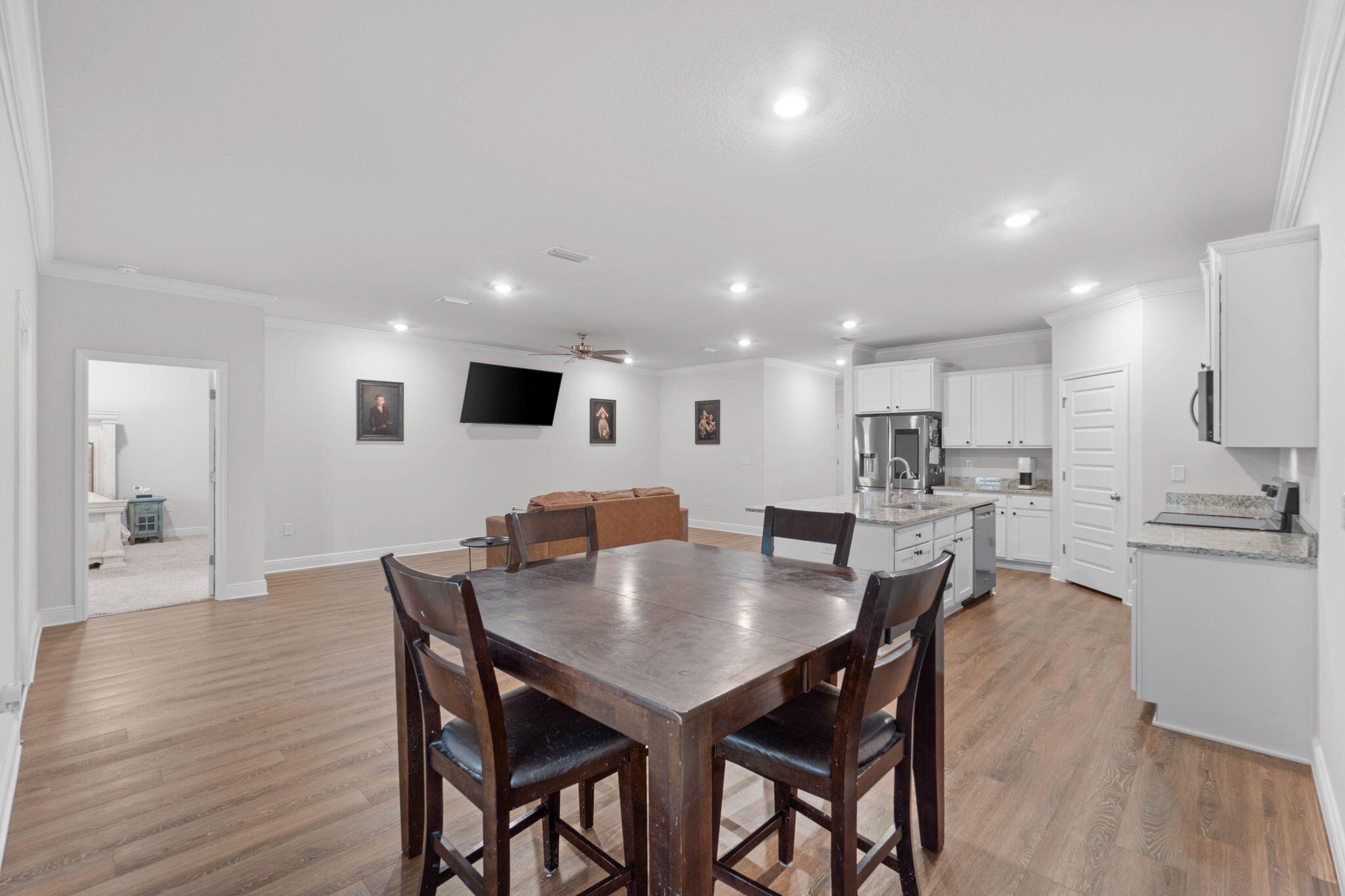 371 Lightning Bug Lane Freeport, FL 32439 - Photo 9 of 56 a kitchen with a dining table chairs and wooden floor