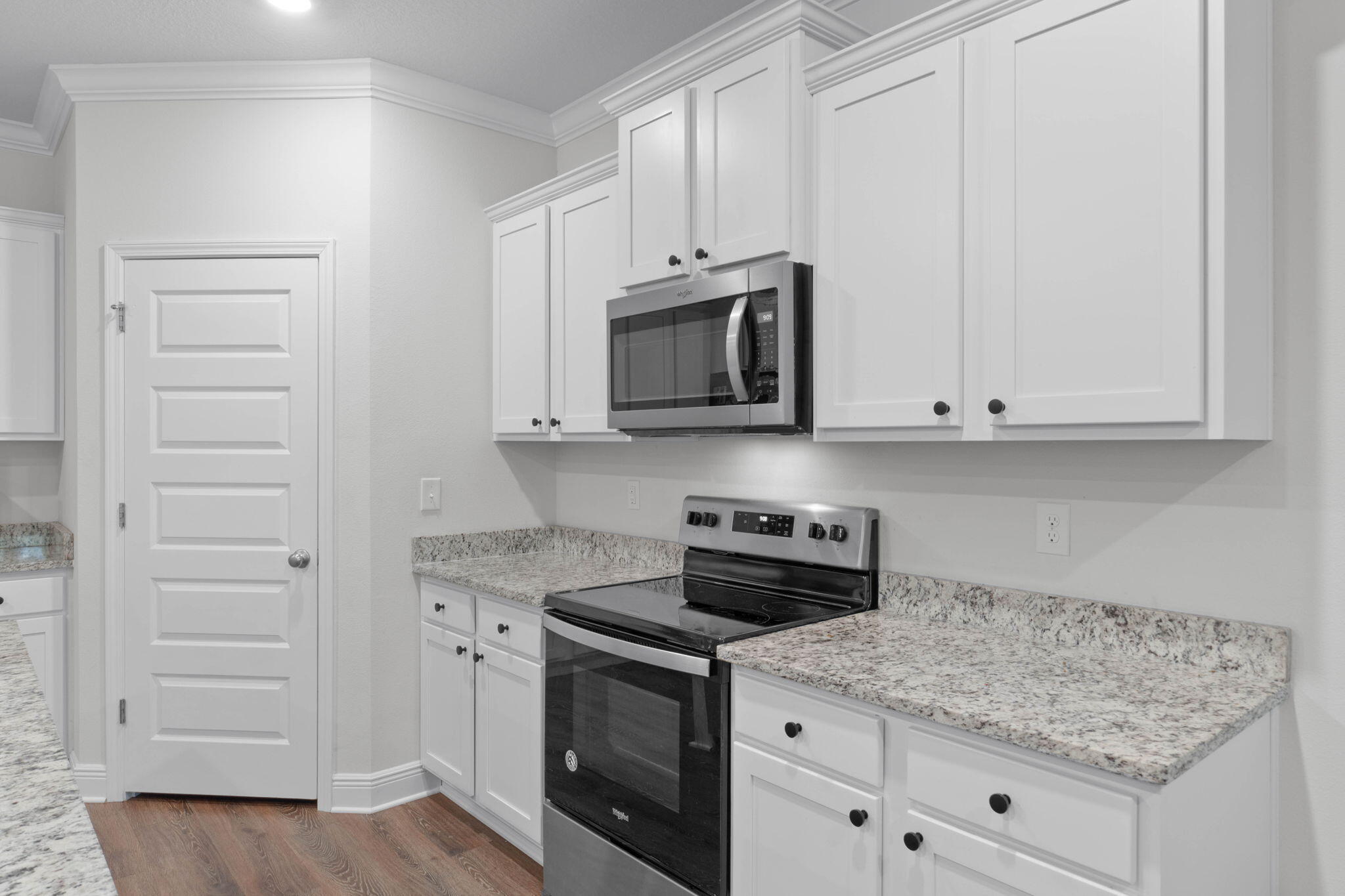 371 Lightning Bug Lane Freeport, FL 32439 - Photo 10 of 53 a kitchen with stainless steel appliances granite countertop white cabinets and a stove a oven with white countertops