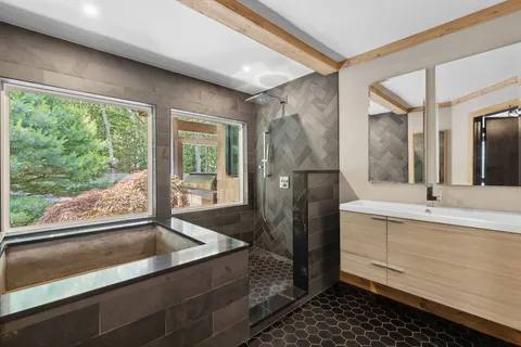 a bathroom with a double vanity sink and mirror