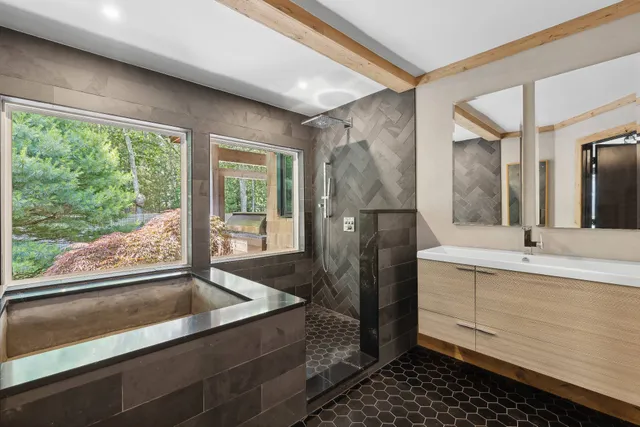 a bathroom with a double vanity sink and mirror