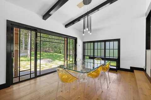 a view of a swimming pool with seating space