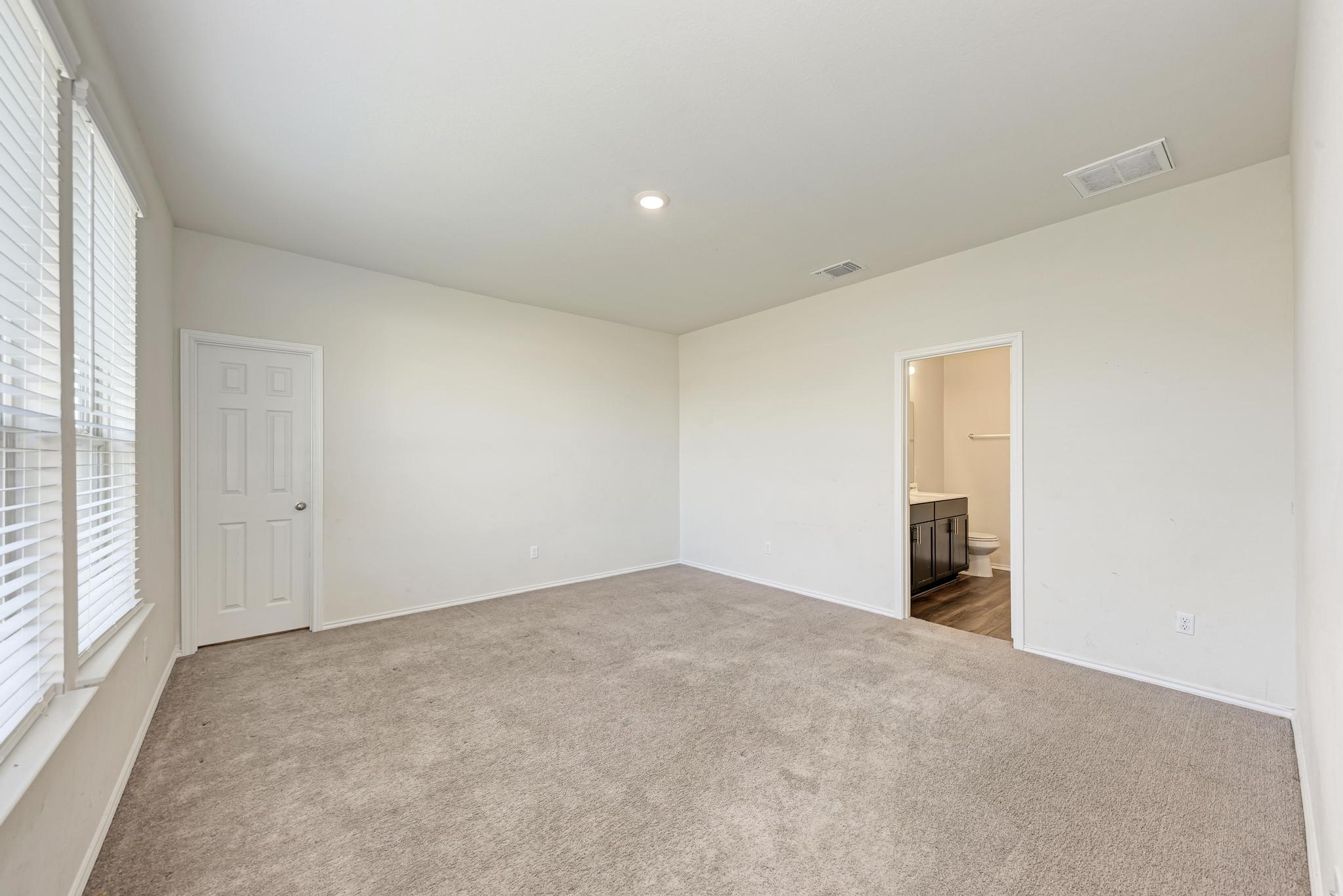 201 Pivot Drive Taylor, TX 76574 - Photo 15 of 34 an empty room with a natural light