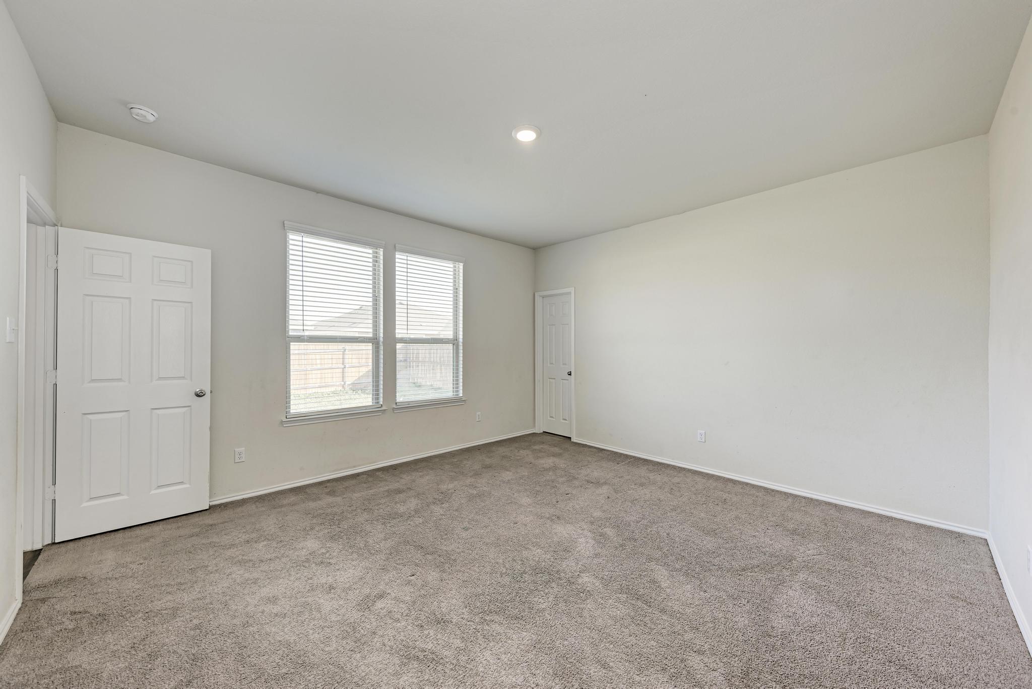 201 Pivot Drive Taylor, TX 76574 - Photo 16 of 34 an empty room with a window