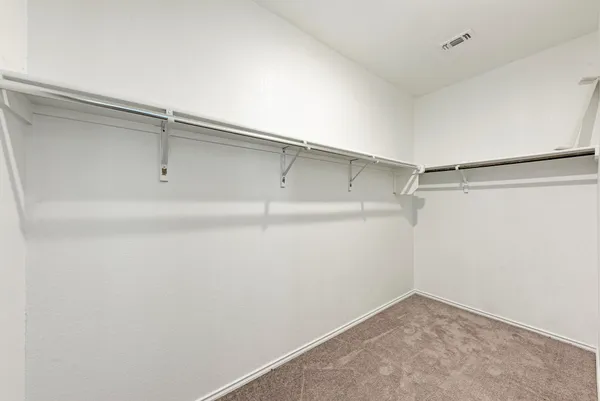 a view of an empty walk in closet