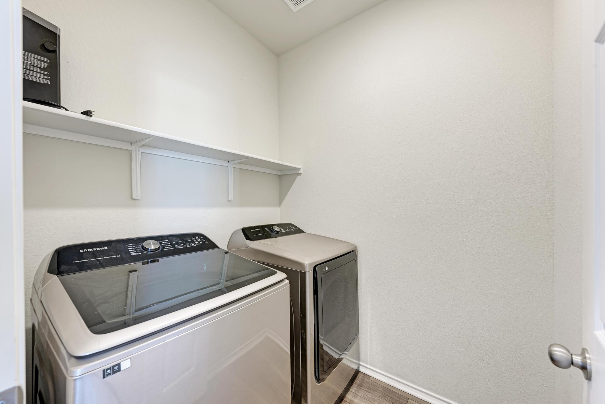 201 Pivot Drive Taylor, TX 76574 - Photo 28 of 34 a utility room with dryer and washer