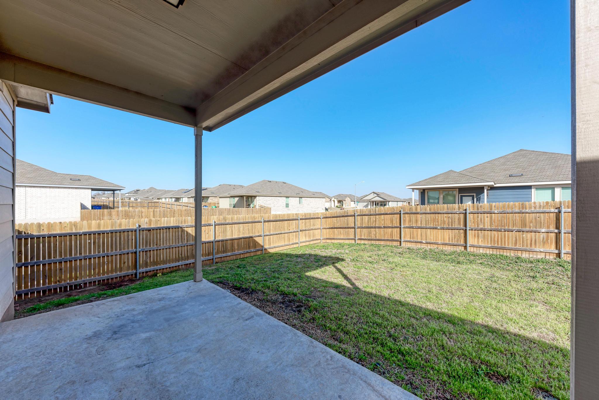 201 Pivot Drive Taylor, TX 76574 - Photo 29 of 34 a view of a backyard with wooden fence