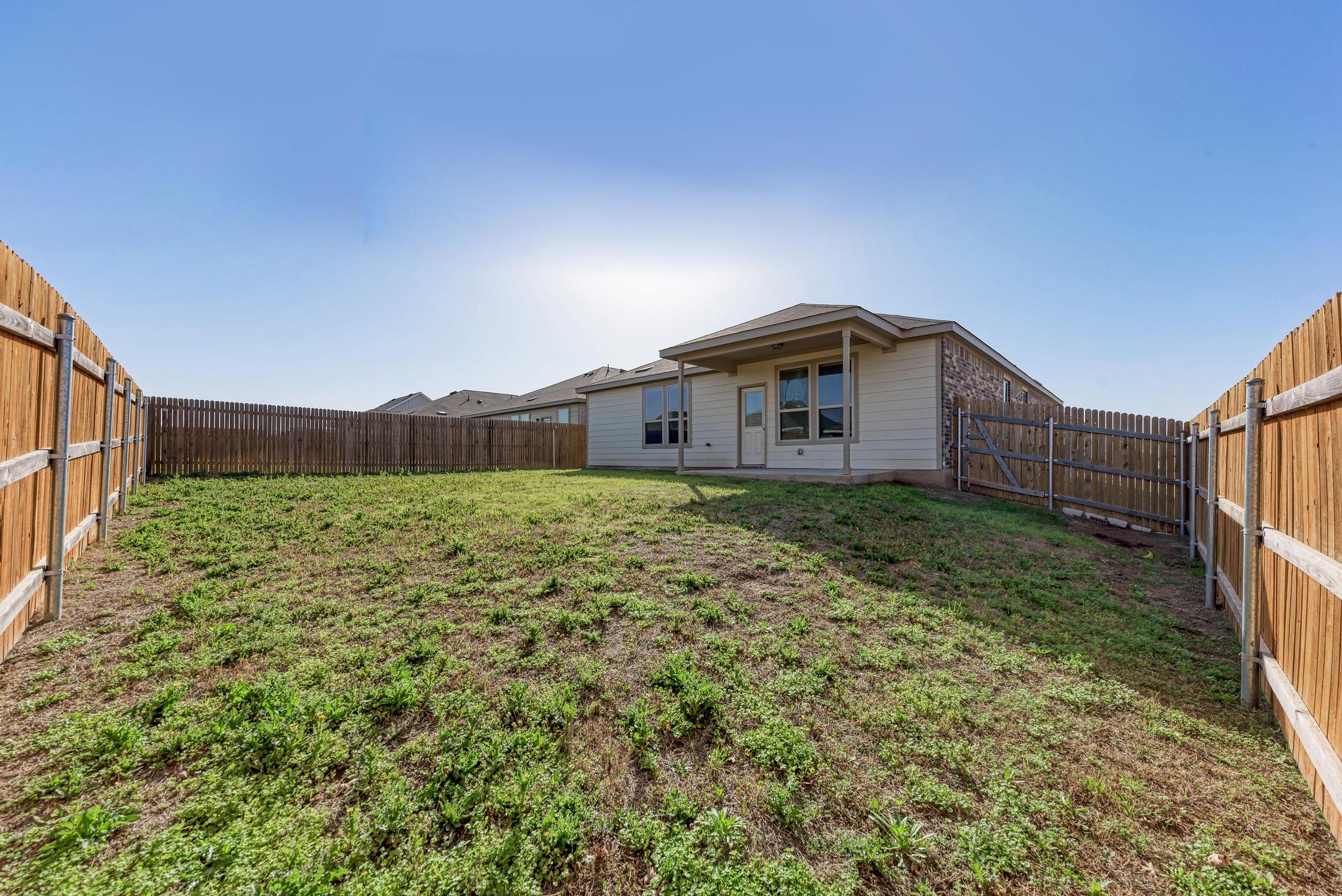 201 Pivot Drive Taylor, TX 76574 - Photo 33 of 34 a view of a house with a yard