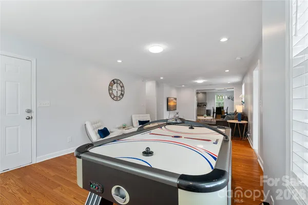 a view of a dining table chairs and wooden floor