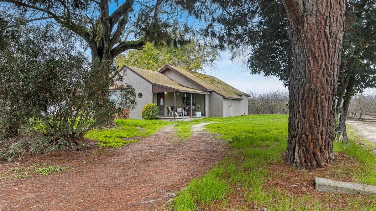 20339 Sexton Road Escalon, CA 95320 - Photo 11 of 38 a view of house that has a tree in front of it