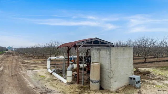 a view of a wooden house with a yard