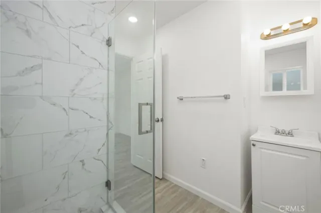 a bathroom with a shower and a toilet