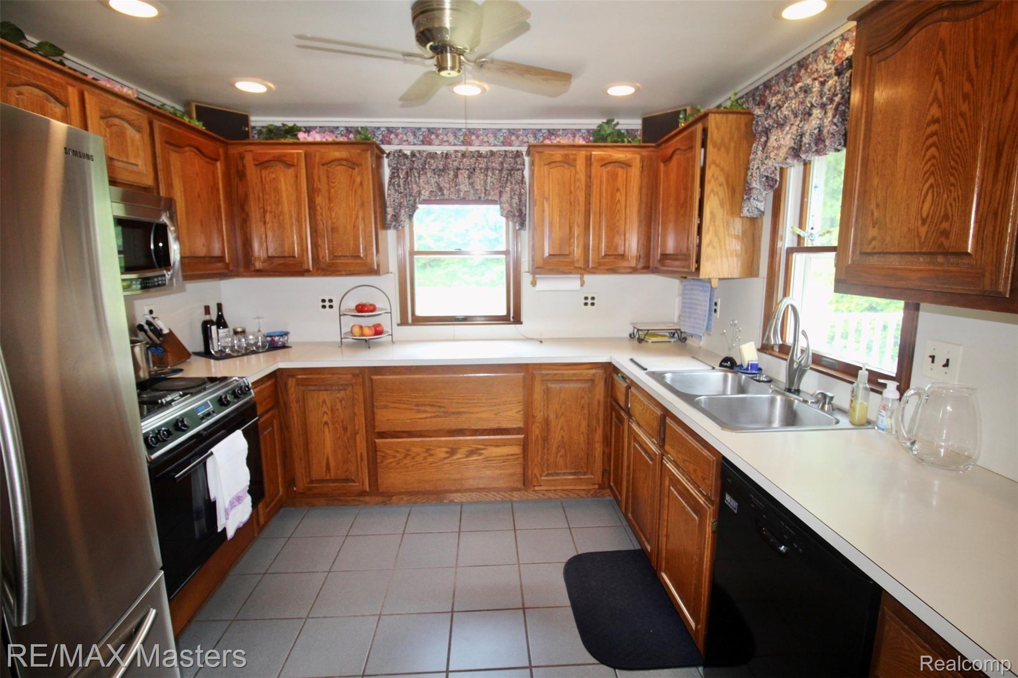 32430 King Road New Boston, MI 48164 - Photo 11 of 36 A large kitchen with backyard views and easy access to your huge backyard 2-level deck.