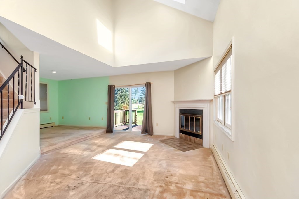 4 Jill Lane, Unit A Sterling, MA 01564 - Photo 11 of 38 a view of a livingroom with an empty space and a fireplace