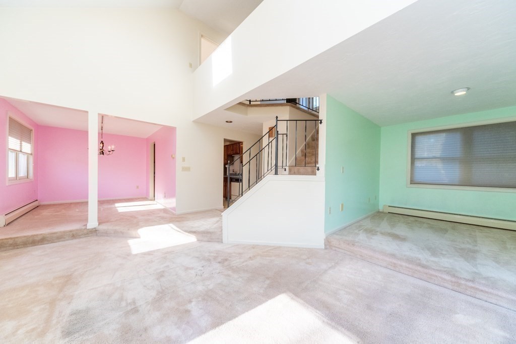 4 Jill Lane, Unit A Sterling, MA 01564 - Photo 12 of 38 a view of a livingroom with an empty space and windows