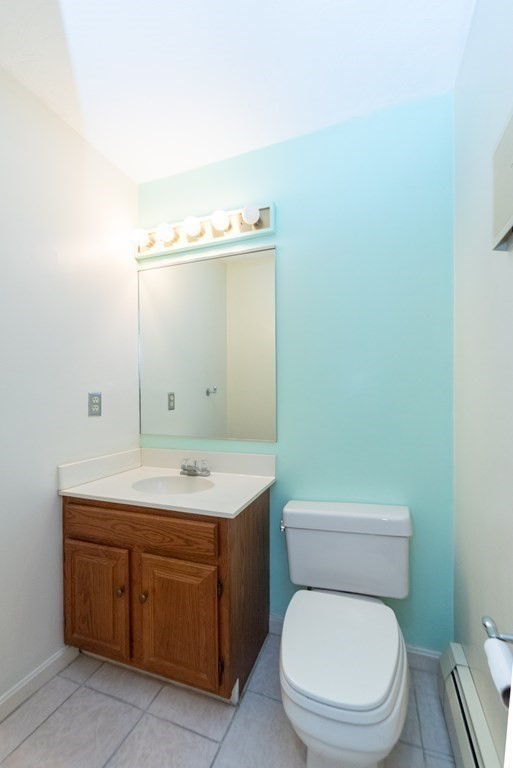 4 Jill Lane, Unit A Sterling, MA 01564 - Photo 15 of 38 a bathroom with a toilet a sink and mirror