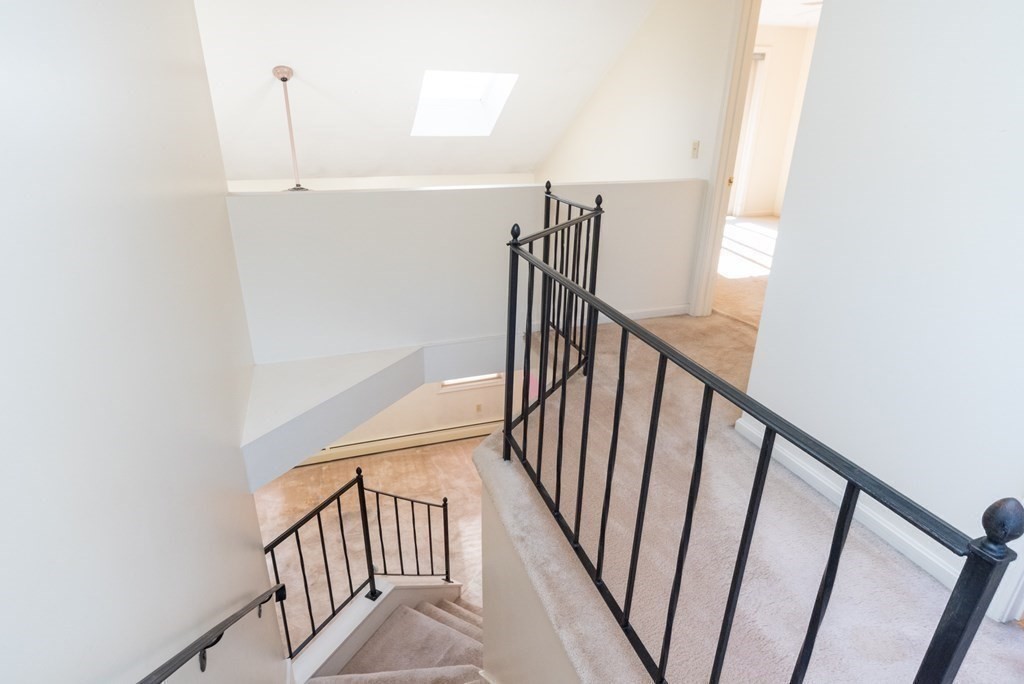 4 Jill Lane, Unit A Sterling, MA 01564 - Photo 17 of 38 a view of staircase with railing and white walls