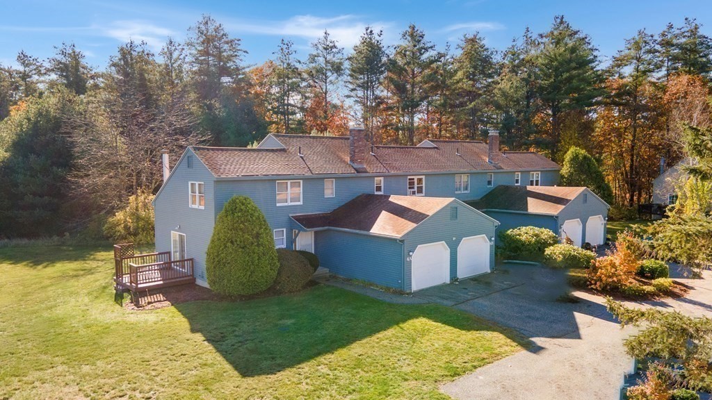 4 Jill Lane, Unit A Sterling, MA 01564 - Photo 2 of 38 an aerial view of a house with swimming pool garden and mountain view