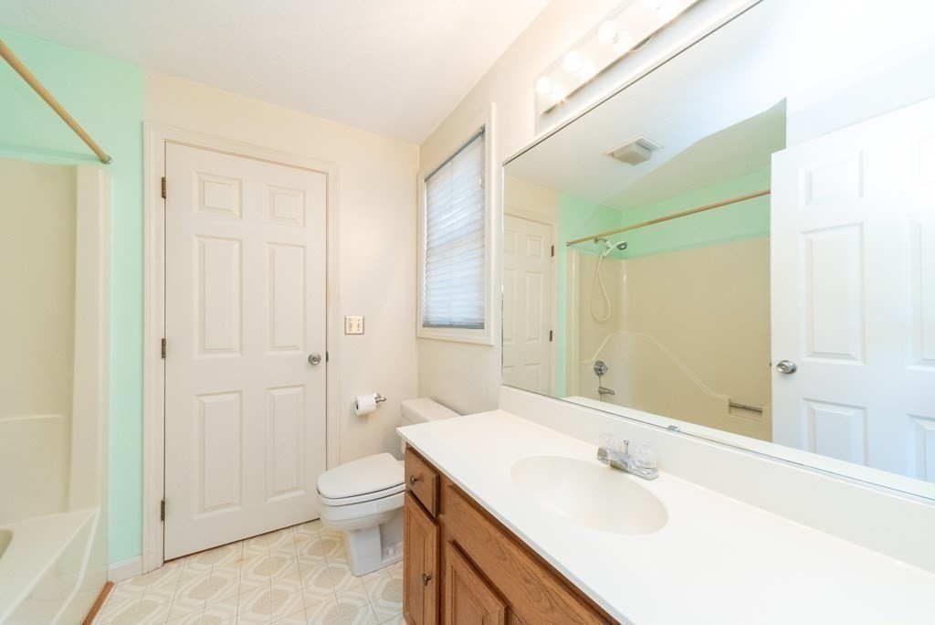 4 Jill Lane, Unit A Sterling, MA 01564 - Photo 22 of 38 a bathroom with a sink a toilet and shower