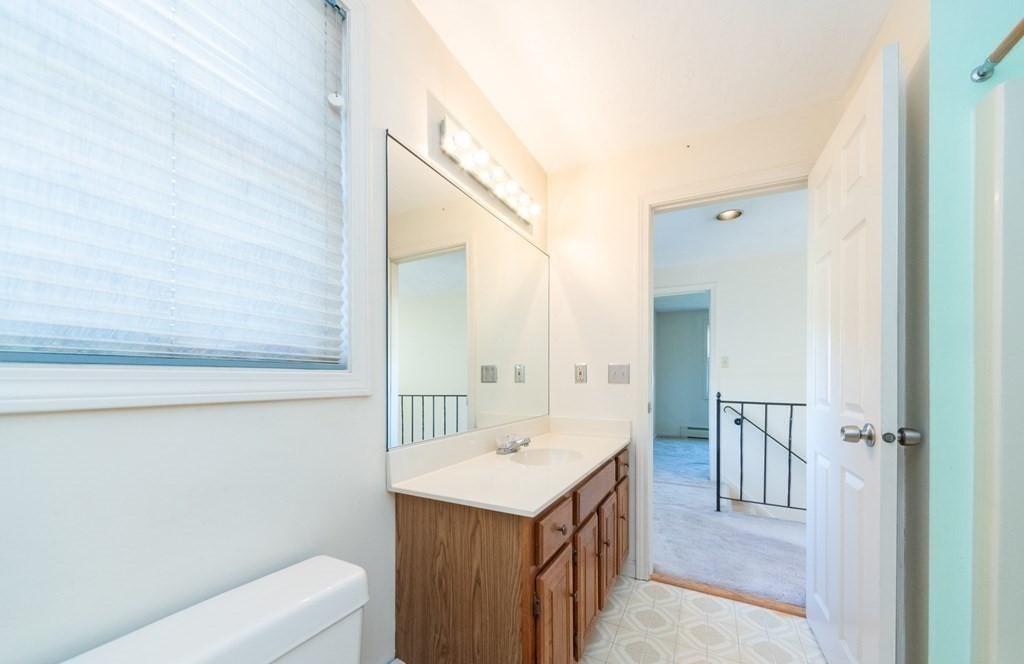 4 Jill Lane, Unit A Sterling, MA 01564 - Photo 23 of 38 a bathroom with a sink a toilet and shower