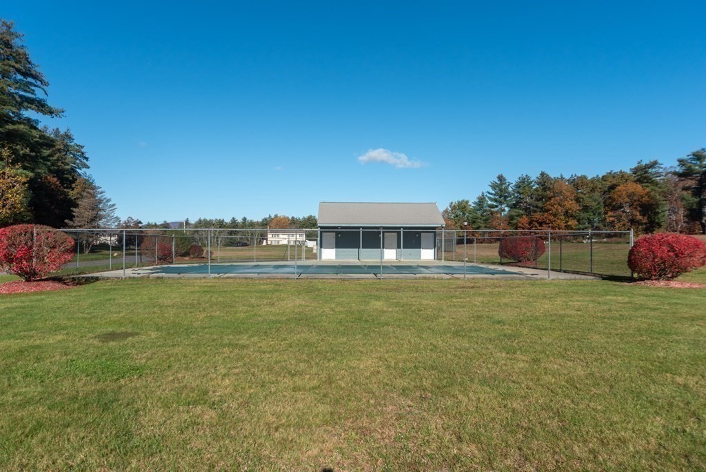 4 Jill Lane, Unit A Sterling, MA 01564 - Photo 32 of 38 a front view of a house with a garden