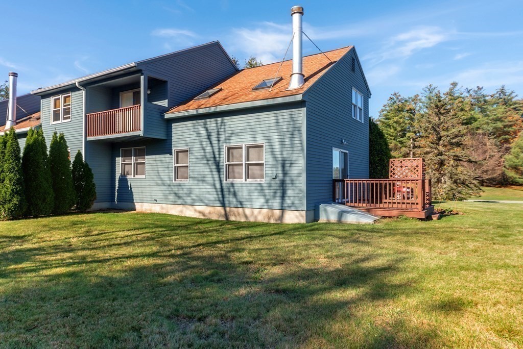 4 Jill Lane, Unit A Sterling, MA 01564 - Photo 35 of 38 a backyard of a house with table and chairs