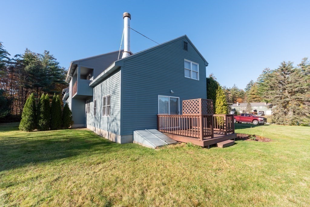4 Jill Lane, Unit A Sterling, MA 01564 - Photo 4 of 38 a front view of a house with a yard