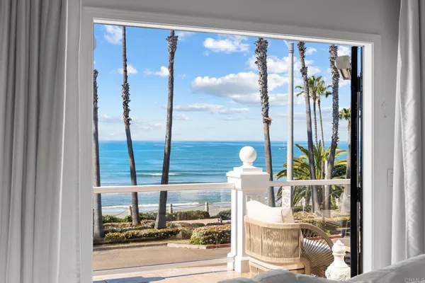 a picture of a glass door with a view of living room