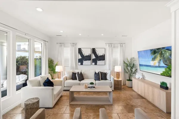 a living room with furniture and a flat screen tv