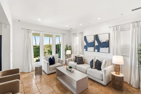 a living room with furniture and a large window