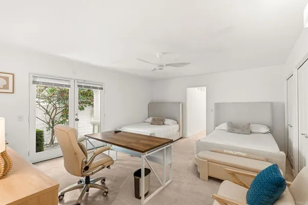 a bedroom with a bed and a table