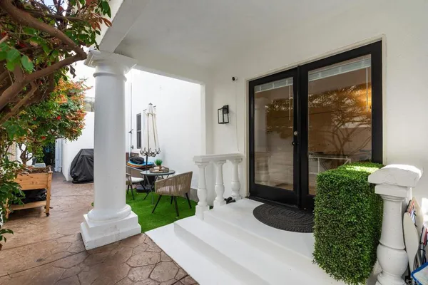 a front view of a house with garden