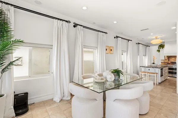 a bathroom with a granite countertop sink a mirror and a shower
