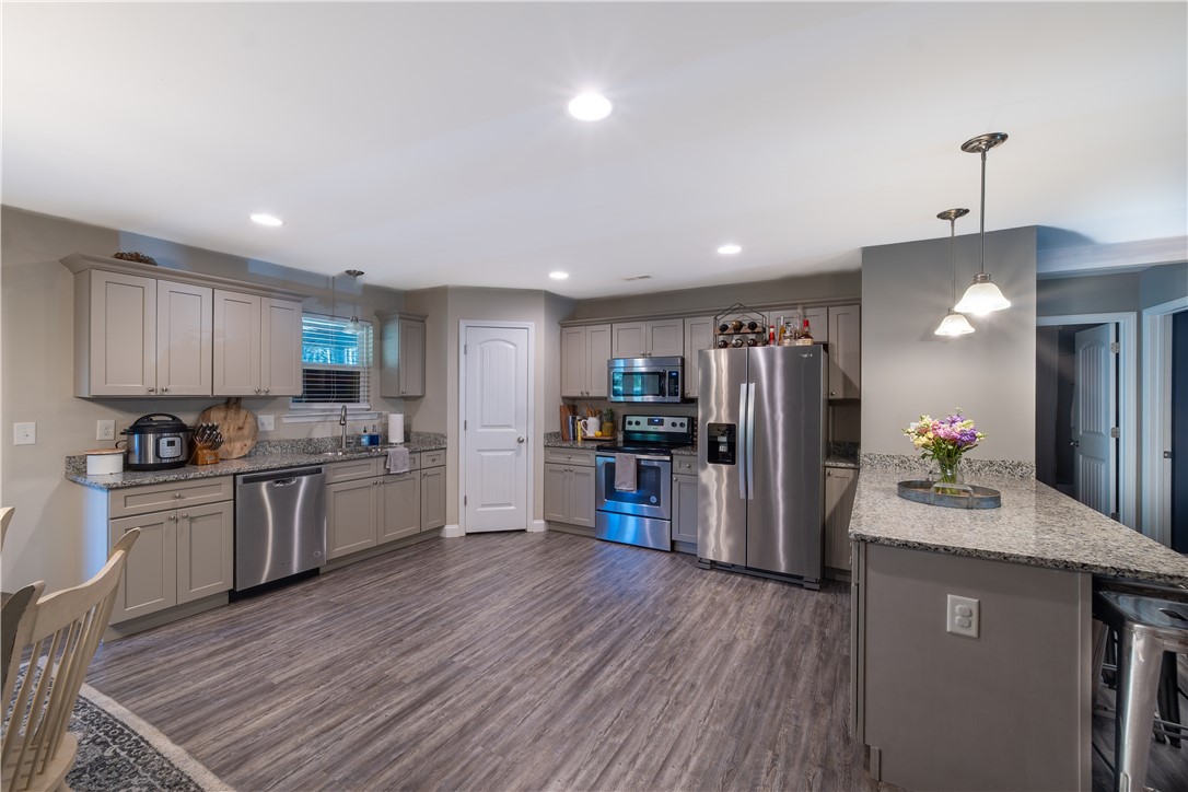 400 Green View Court Westminster, SC 29693 - Photo 8 of 33 This spacious kitchen features modern appliances and ample counter space for all your culinary needs.